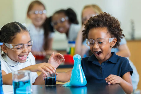 Children experimenting with science beakers.